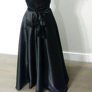 Long black satin skirt.